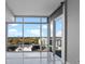 Bright living room with large windows offering city views and marble floors at 101 S Eola Dr # 1001, Orlando, FL 32801