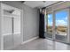 Open living area with balcony access and city views, featuring modern lighting at 101 S Eola Dr # 1001, Orlando, FL 32801