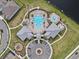 Overhead view of community pool and recreation area with splash pad, surrounded by lush landscaping at 10426 Folly Beach Rd, Orlando, FL 32827