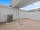 Private brick-paved patio with white fencing and door leading to the main building at 10426 Folly Beach Rd, Orlando, FL 32827