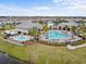 Aerial view of community pool and recreation area with ample seating and splash pad at 10426 Folly Beach Rd, Orlando, FL 32827