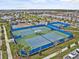 Community tennis and pickleball courts surrounded by lush landscaping and residential area at 10426 Folly Beach Rd, Orlando, FL 32827