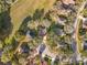 Aerial view showcases rooftops and tree canopies in a quiet residential neighborhood at 1121 Magnolia Blossom Ct, Apopka, FL 32712