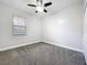 Neutral bedroom has a ceiling fan and window at 1121 Magnolia Blossom Ct, Apopka, FL 32712