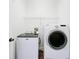 Laundry room featuring a side-by-side washer and dryer at 1121 Magnolia Blossom Ct, Apopka, FL 32712