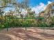 Community playground area with swings surrounded by mature trees at 1121 Magnolia Blossom Ct, Apopka, FL 32712