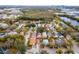 Aerial view of a residential neighborhood, showing nearby pond and distant city skyline at 1201 City Park Ave, Orlando, FL 32808