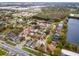 Aerial view of a residential neighborhood, showing nearby lake and commercial area at 1201 City Park Ave, Orlando, FL 32808