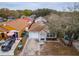 Aerial view of the home featuring a well-maintained lawn and the home's exterior at 1201 City Park Ave, Orlando, FL 32808