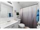 Bathroom featuring clean white fixtures, a vanity with ample counter space, and a toilet at 1201 City Park Ave, Orlando, FL 32808