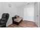 Bedroom featuring neutral-colored walls, wood floors, an office chair, and closet at 1201 City Park Ave, Orlando, FL 32808