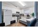 Well-lit eat-in kitchen featuring modern appliances, granite countertops, and white cabinetry at 1201 City Park Ave, Orlando, FL 32808