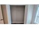 This is a closet with white doors and a wire shelf for optimal storage at 1322 Maryland Ave, St Cloud, FL 34769