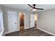 Main bedroom features gray vinyl floors and an ensuite bathroom with standup shower at 1322 Maryland Ave, St Cloud, FL 34769