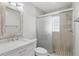 Modern bathroom features new tile, vanity, and glass-enclosed shower at 1412 Borg Ln, Winter Springs, FL 32708