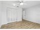 Bedroom with modern flooring, a closet, a ceiling fan, and fresh, neutral paint at 1412 Borg Ln, Winter Springs, FL 32708