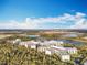 Beautiful aerial view of the resort surrounded by lush greenery and serene lakes, showing the expansive property and natural beauty at 14501 Grove Resort Grove Resort Ave # 3733, Winter Garden, FL 34787