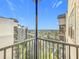 Nice view from the balcony overlooking lush greenery, water, and neighboring buildings at 14501 Grove Resort Grove Resort Ave # 3733, Winter Garden, FL 34787
