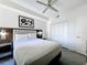 Comfortable bedroom featuring neutral decor, a ceiling fan, and closet for ample storage space at 14501 Grove Resort Grove Resort Ave # 3733, Winter Garden, FL 34787
