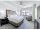 Comfortable bedroom with king bed, ceiling fan, carpet, and ample natural light at 14501 Grove Resort Grove Resort Ave # 3733, Winter Garden, FL 34787