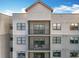 Exterior elevation of condo building with a private balcony, perfect for enjoying the outdoor scenery and fresh air at 14501 Grove Resort Grove Resort Ave # 3733, Winter Garden, FL 34787