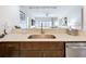 Well-appointed kitchen with stainless steel appliances, stone countertops, and a view into the open-concept living area at 14501 Grove Resort Grove Resort Ave # 3733, Winter Garden, FL 34787