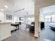Bright and airy living space with open floor plan, seamlessly connecting the living, dining, and kitchen areas at 14501 Grove Resort Grove Resort Ave # 3733, Winter Garden, FL 34787