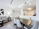 Modern living room with dining area, comfortable seating, and a view of the kitchen, perfect for relaxation and entertaining guests at 14501 Grove Resort Grove Resort Ave # 3733, Winter Garden, FL 34787