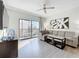 Comfortable living room with a large sectional sofa, stylish decor, and a sliding glass door leading to the balcony at 14501 Grove Resort Grove Resort Ave # 3733, Winter Garden, FL 34787