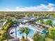 Waterpark featuring a splash pad with a yellow slide and fountains, surrounded by palm trees at 14501 Grove Resort Grove Resort Ave # 3733, Winter Garden, FL 34787