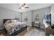 Bedroom with light gray walls and wood-look floors, creating a serene retreat at 149 E Muriel St, Orlando, FL 32806