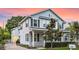 Charming two-story home with a manicured front lawn, brick driveway, and inviting front porch at 149 E Muriel St, Orlando, FL 32806