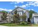Charming two-story home featuring a inviting front porch and beautifully landscaped front yard at 149 E Muriel St, Orlando, FL 32806