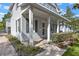 Charming home with covered front porch, stone walkway and lush landscaping at 149 E Muriel St, Orlando, FL 32806