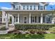 Inviting front porch with white columns, dark shutters, and a well-maintained hedge at 149 E Muriel St, Orlando, FL 32806