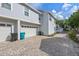 Attached two-car garage with a paver driveway and well-maintained exterior at 149 E Muriel St, Orlando, FL 32806