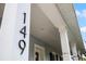 Close-up of the house number 149 on the column of the home's porch at 149 E Muriel St, Orlando, FL 32806