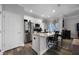 Bright kitchen with granite countertops, stainless steel appliances, and a functional island at 149 E Muriel St, Orlando, FL 32806