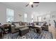 Bright living room with a large sofa, hardwood floors, and access to kitchen area at 149 E Muriel St, Orlando, FL 32806