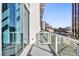 Balcony featuring glass railings and views of the surrounding city at 150 E Robinson St # 209, Orlando, FL 32801