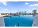 Rooftop pool featuring lounge chairs, city views, and clear blue water for relaxation and enjoyment at 150 E Robinson St # 209, Orlando, FL 32801