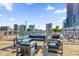 Modern rooftop lounge area with comfortable outdoor seating and scenic views of the city skyline at 150 E Robinson St # 209, Orlando, FL 32801