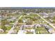 Aerial view of a neighborhood with mature trees showing the property location near local businesses at 1503 Wisconsin Ave, St Cloud, FL 34769