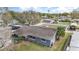 Home aerial view showcasing the roof, fenced yard, and nearby water tower at 1503 Wisconsin Ave, St Cloud, FL 34769