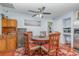 Comfortable dining room with ceiling fan, hardwood floors and area rug at 1503 Wisconsin Ave, St Cloud, FL 34769