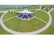 Expansive outdoor amphitheater with covered stage, tiered seating, and surrounding green space by a lake at 1546 Park Leah Cir, Apopka, FL 32712