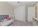 Bright bedroom with a crib, closet, desk, and door to the hallway at 1546 Park Leah Cir, Apopka, FL 32712