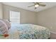 Cozy bedroom featuring a ceiling fan and natural light from the window at 1546 Park Leah Cir, Apopka, FL 32712