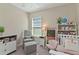 Well-lit bedroom with a chair, ottoman, and ' furniture set at 1546 Park Leah Cir, Apopka, FL 32712