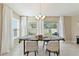 Bright dining room with elegant chandelier, neutral walls, and sliding glass doors to the outside patio at 1546 Park Leah Cir, Apopka, FL 32712